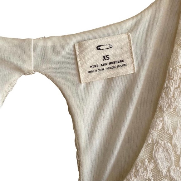 PINS & NEEDLES | Ivory Sleeveless Lace Cutout Back Peplum Mini Cocktail Dress - Picture 8 of 11